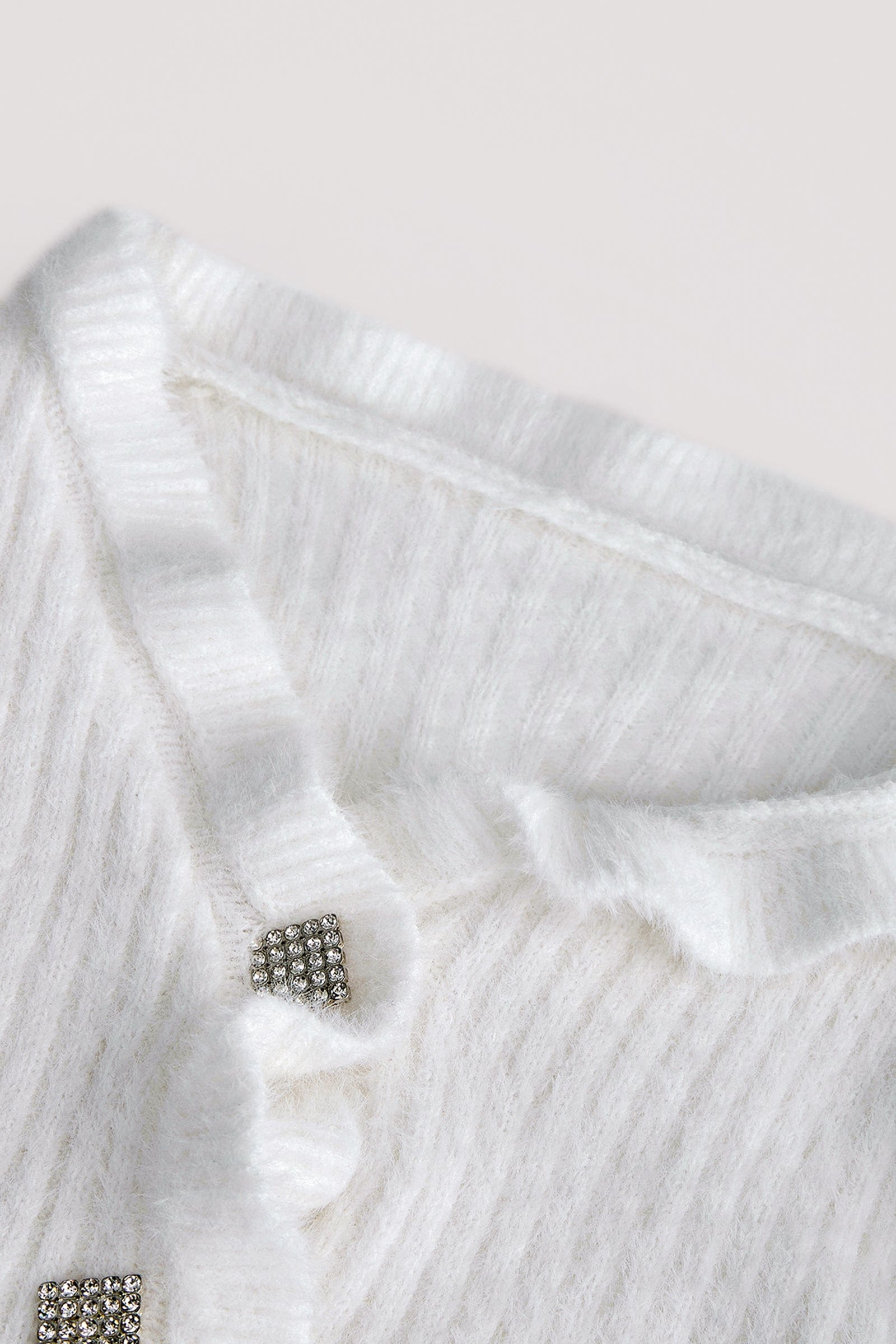 White Ruffle Trim Ribbed Knit Fitted Cardigan