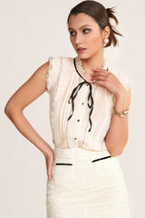 Ivory Sleeveless Ruffled Tie Neck Blouse